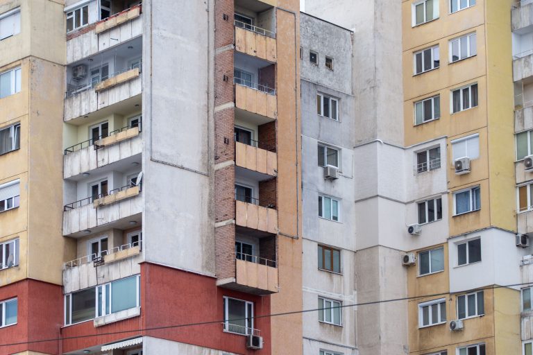 GO Residential REIT Shows Strong Rental Performance Amid Expansion 1 Close-up view of urban residential apartment buildings showcasing diverse architectural styles